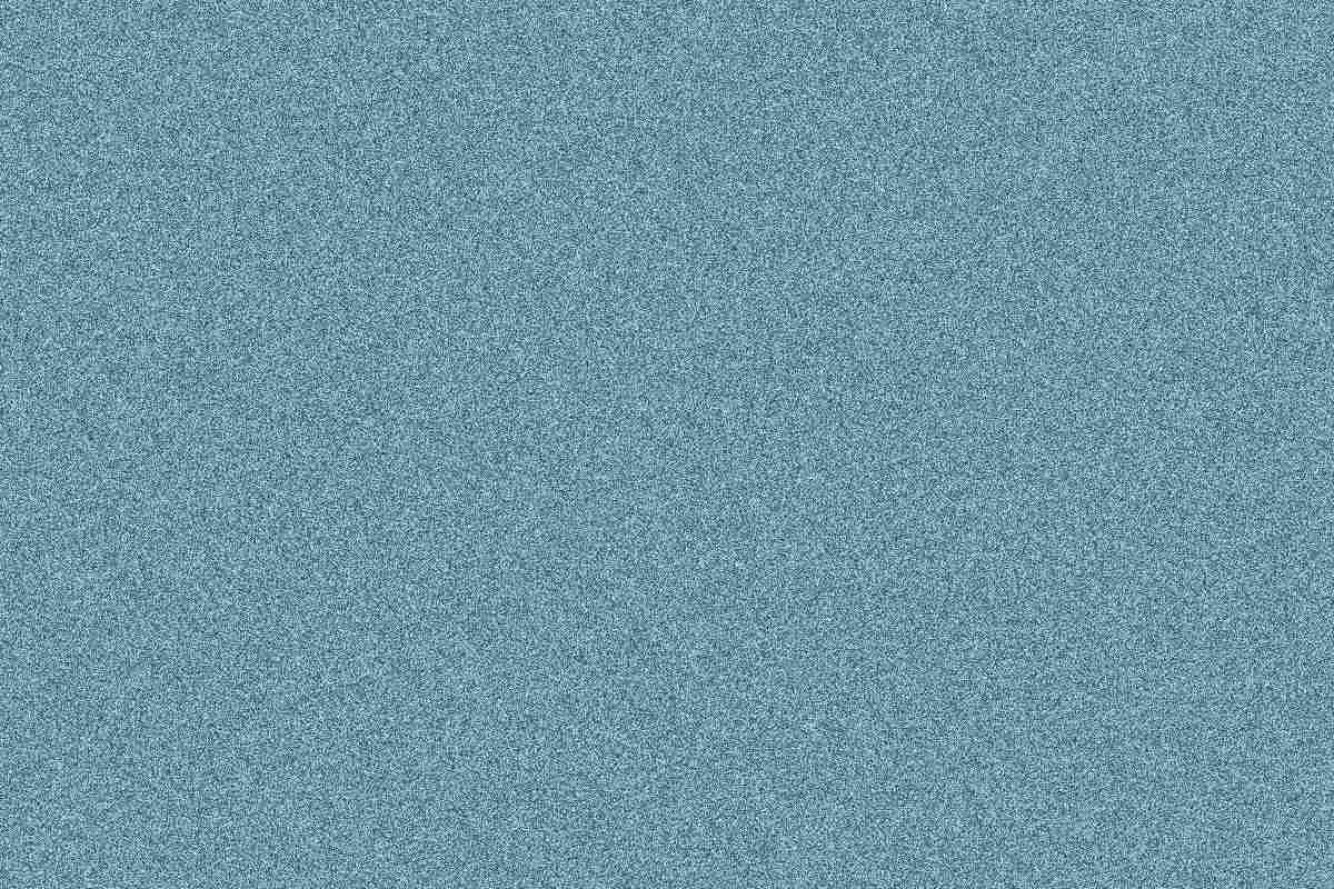 Synthetic texture compressed to under 100,000 bytes; inspect the lost fine detail